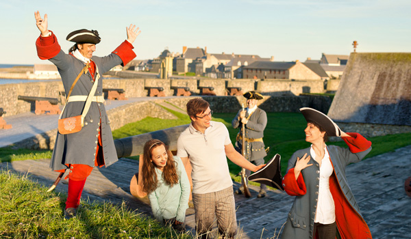 Tourists interacting with actors at Fortress of Louisbourg.