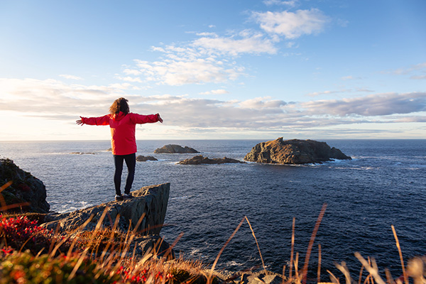 Person standing on the cliffs at Twillingate.