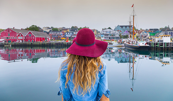 Woman looking at the Lunenburg cove.