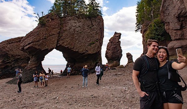 Photo collage showing the high and low tides at Hopewell Rocks.